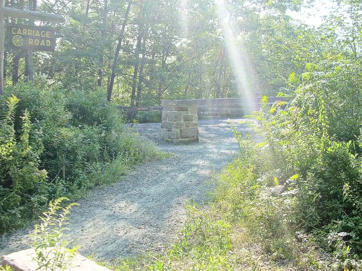 Carriage-road approach at Duck Brook Bridge in Acadia; not a promise of current trail access.