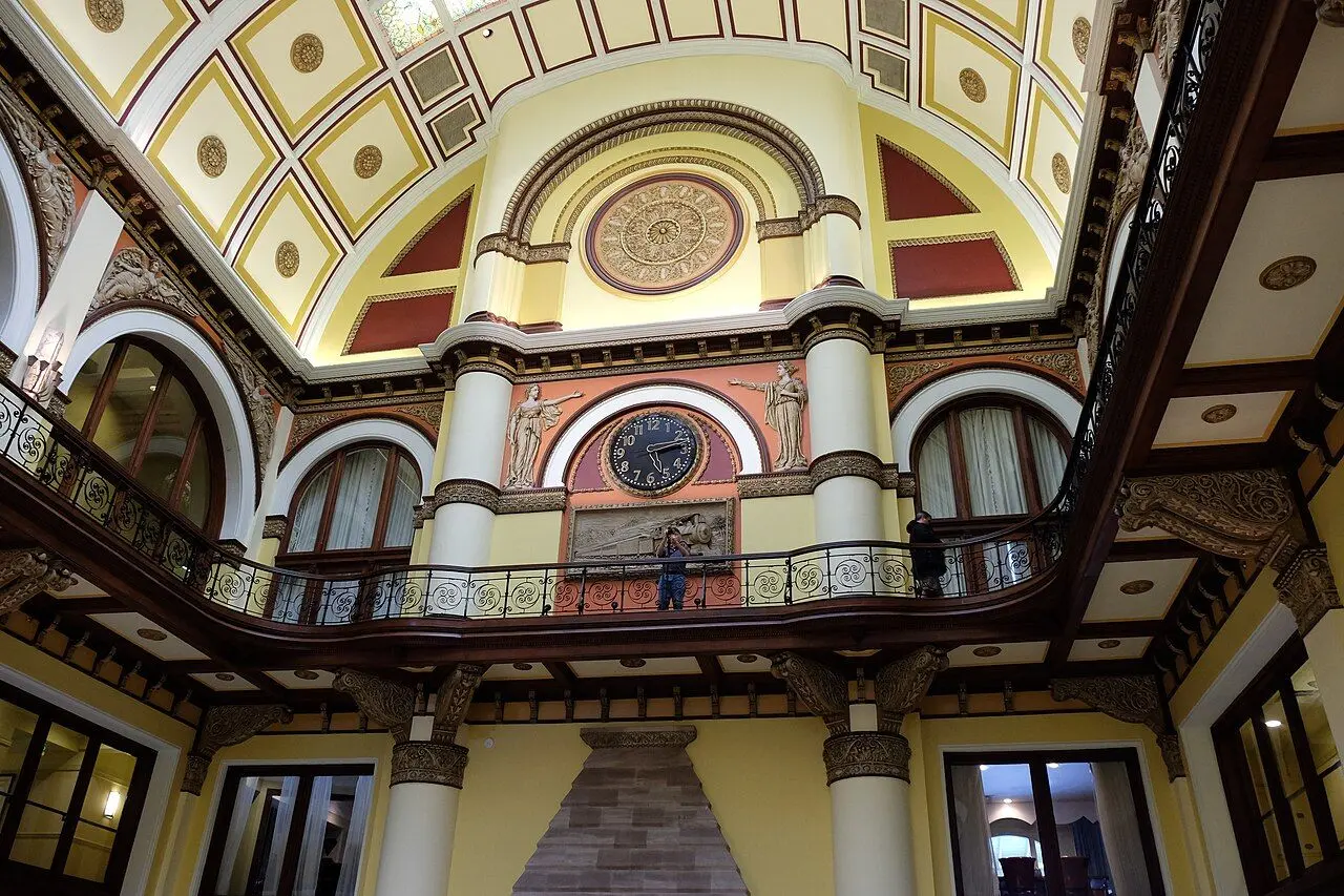 Arched stained-glass ceiling and station clock inside Nashville Union Station Hotel